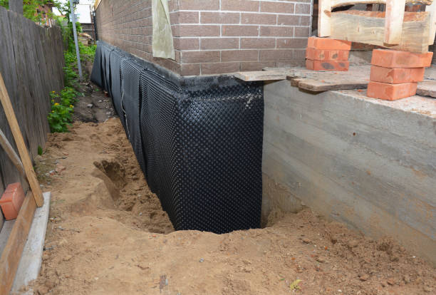 Happy homeowners after waterproofing job in Miamitown
